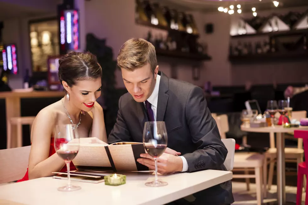 Smiling couple decide what to order