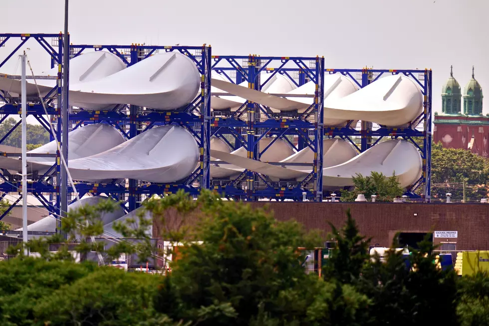 Giant wind turbine blades for the Vineyard Winds project are stacked on racks in New Bedford, Mass. 7/11/23 (AP Photo/Charles Krupa, File)