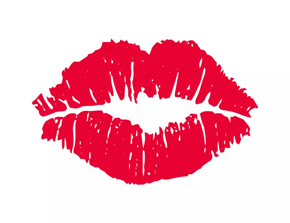 Female red lipstick kiss isolated on white background.