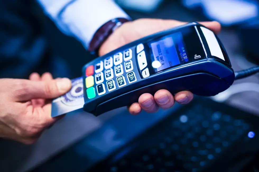 man put the credit card into a reader