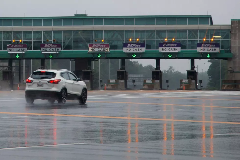 A motorist passes through a New Jersey Turnpike toll plaza in Carneys Point. (AP Photo/Matt Slocum)