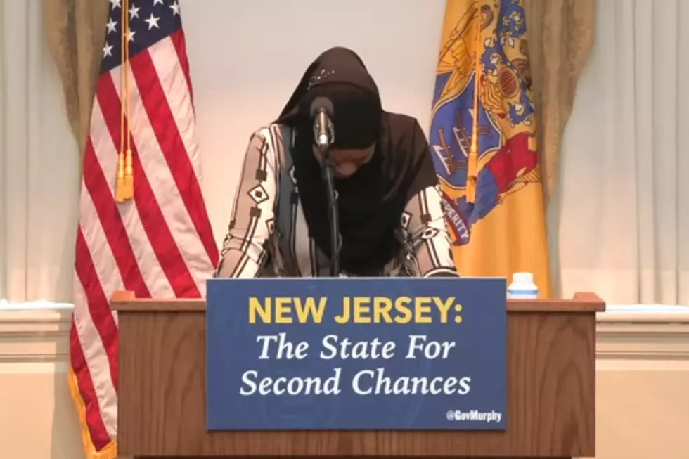 Islah Muhammad fights tears as she welcomes her brother home (New Jersey Office of the Governor)