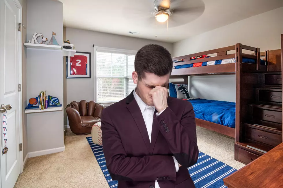 Man in childhood bedroom