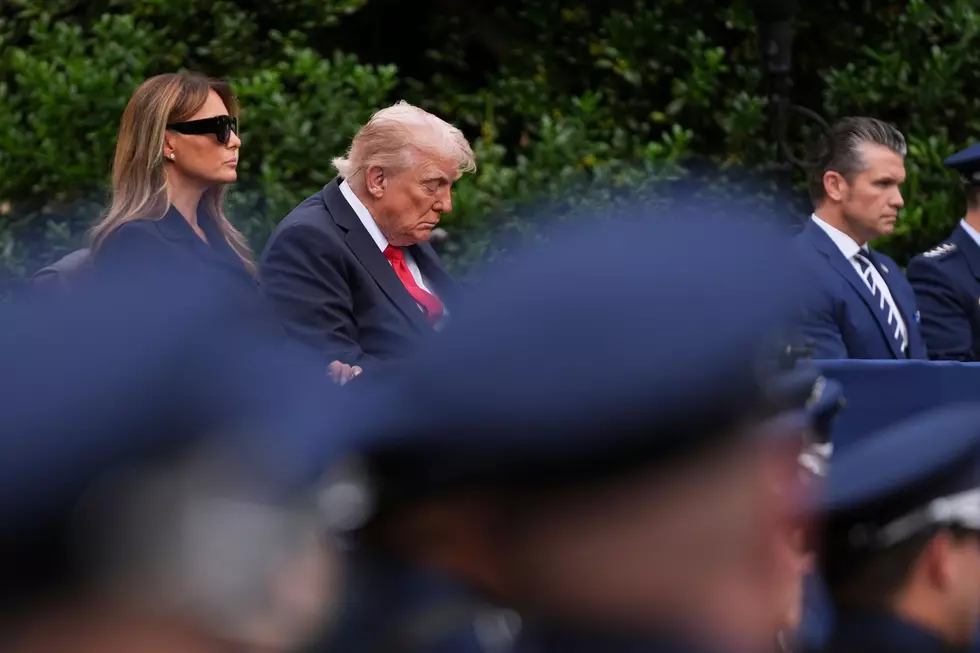 President Donald Trump, first lady Melania Trump and Defense Secretary Pete Hegseth, listen as names are read during a ceremony to commemorate the 24th anniversary of the 9/11 attacks, Thursday, Sept. 11, 2025, at the Pentagon in Washington. (AP Photo/Evan Vucci)