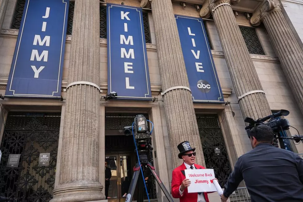 Gregg Donovan holds a sign that says