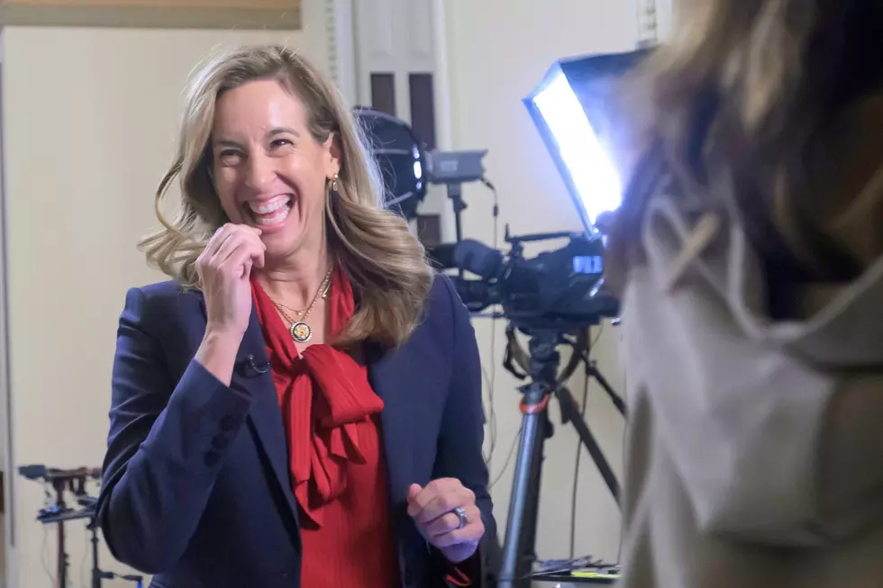 New Jersey Gov.-elect Rep. Mikie Sherrill shares a laugh with people passing by as she prepares for a television interview at the U.S. Capitol, Nov. 12, 2025 (AP Photo/Rod Lamkey, Jr.)