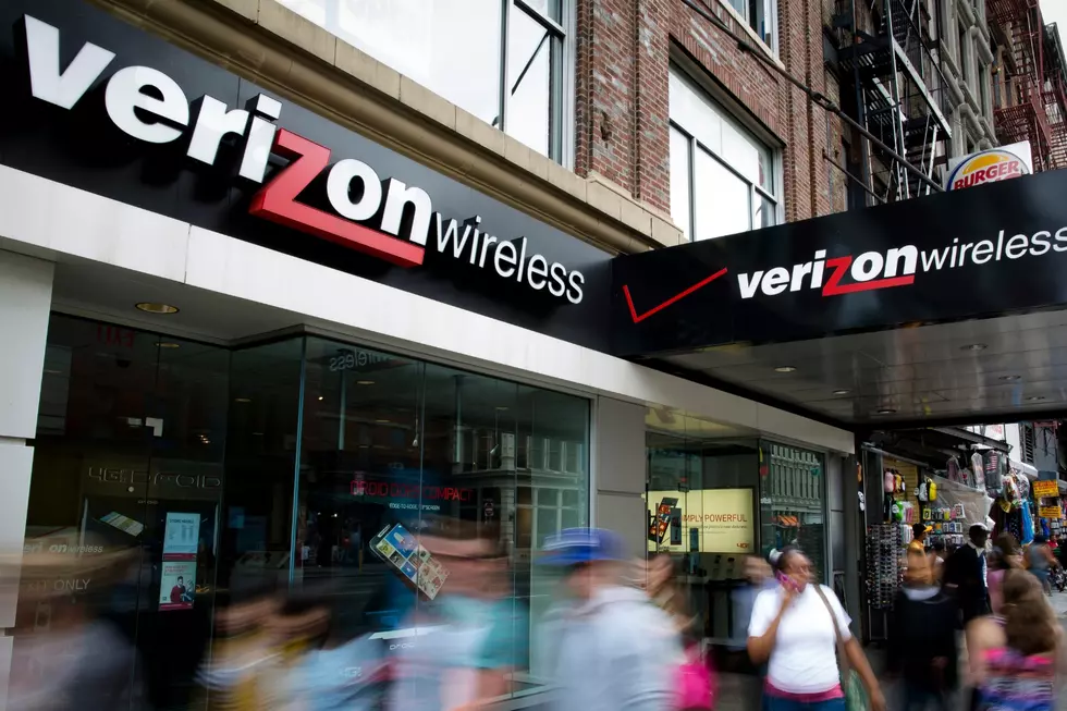 In this June 6, 2013, file photo, pedestrians pass a Verizon Wireless store on Canal Street in New York. (AP Photo/John Minchillo, File)