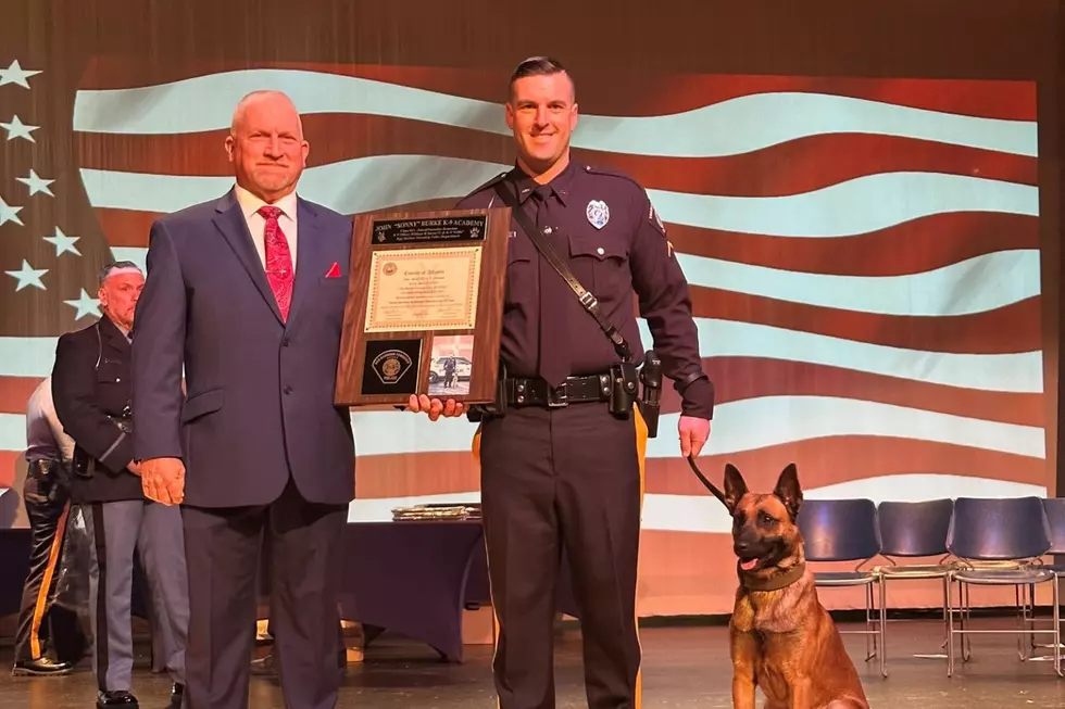 Pleasantville K9 officer William Burns (left)