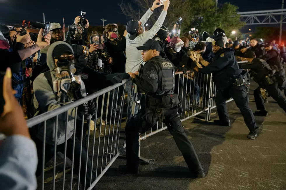 Police try to hold the line as protesters push the fences outside the Delaney Hall detention center during a protest against the transfer of detainees and federal immigration policies on Saturday, May 30, 2026, in Newark, N.J. (AP Photo/Andres Kudacki)