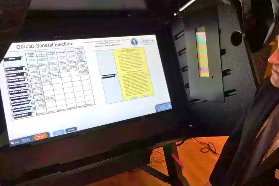 A vendor displays a touchscreen voting machine at an election technology trade show in Trenton. (File, Michael Symons/Townsquare Media NJ)