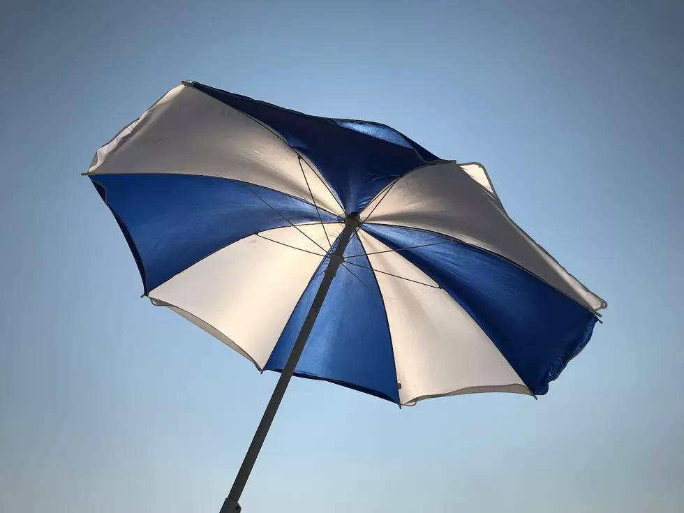 Beach umbrella (Photo by Clay LeConey on Unsplash)
