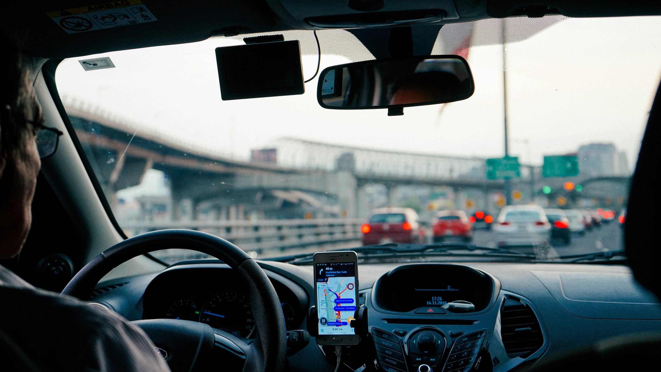 New Jersey driver with meaningful items inside vehicle dashboard and interior