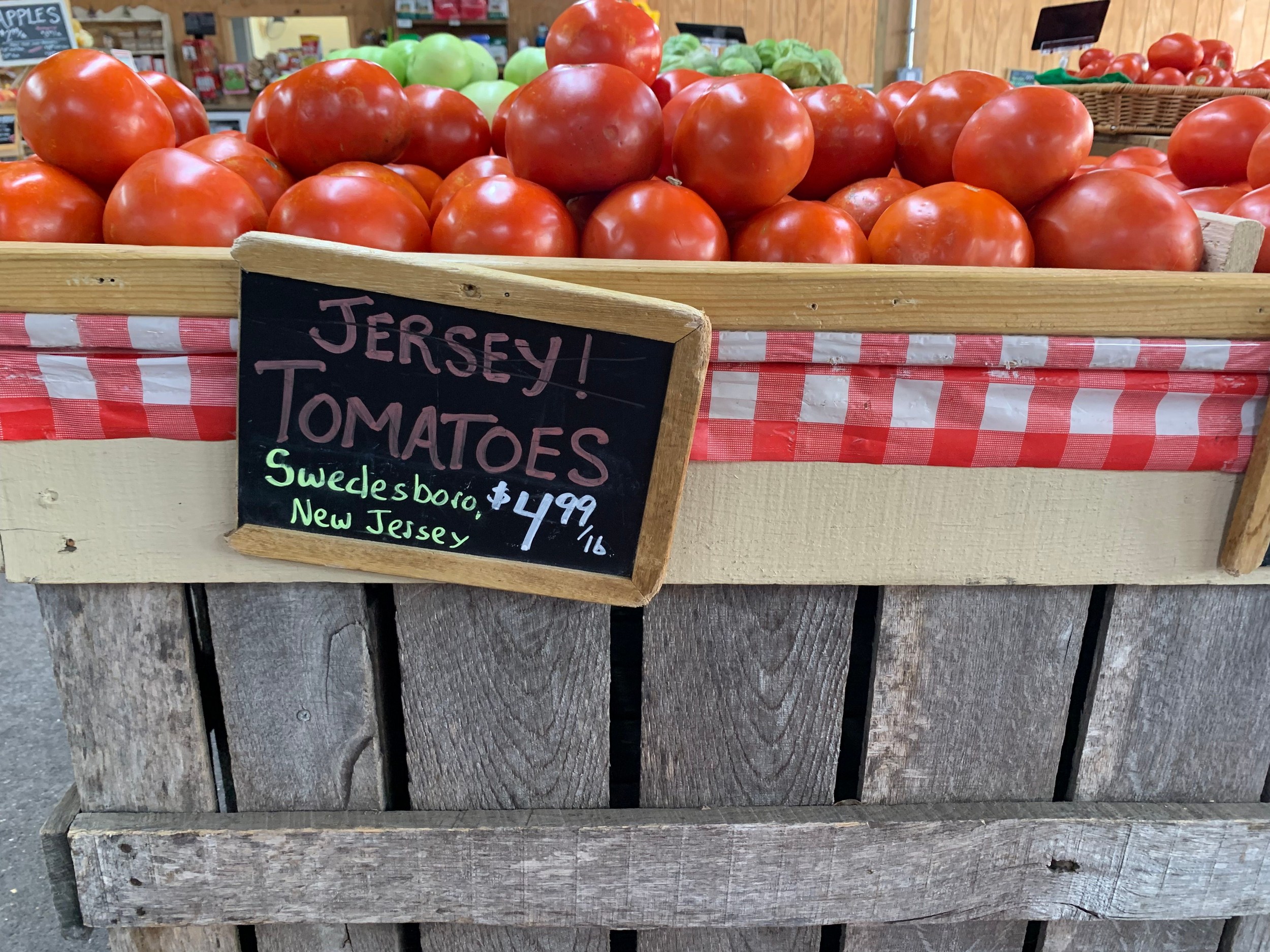 Fresh tomatoes at a South Jersey farm market showcasing locally grown produce