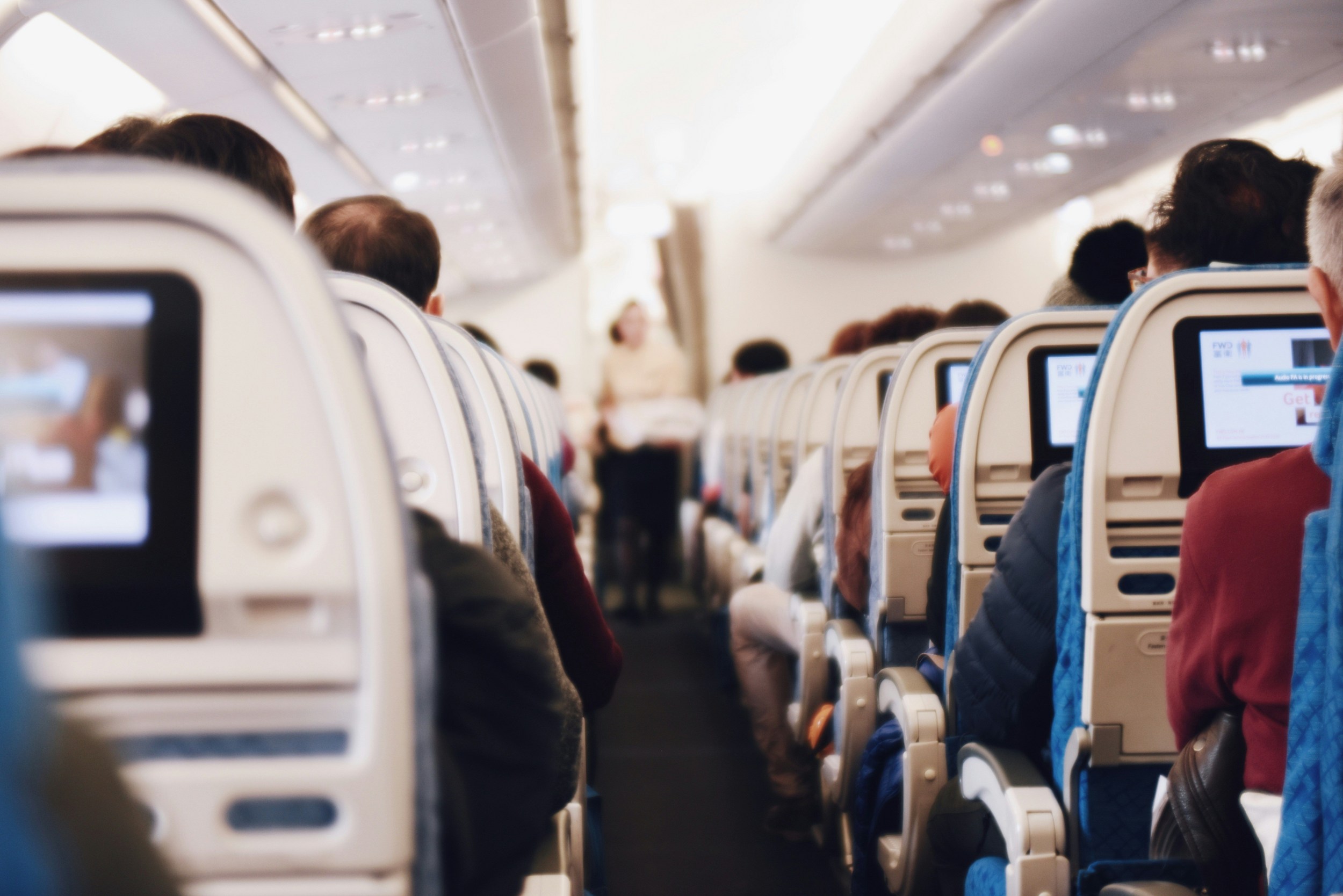 Airplane cabin interior showing passengers during flight