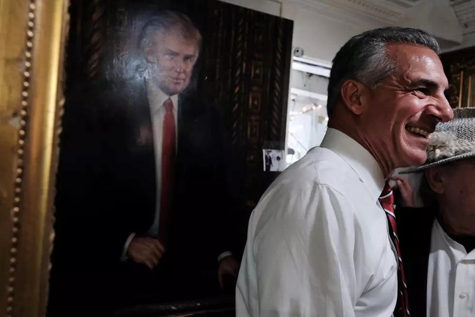 Jack Ciattarelli poses with artist Victor Victori in front of a painting of Donald Trump on Oct. 27, 2021(Spencer Platt, Getty Images)