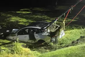 New Jersey driver escapes after Tesla plunges into pond