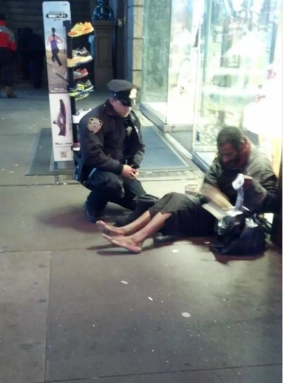 Photo of a New York Cop Giving a Homeless May Shoes Touches Your Heart