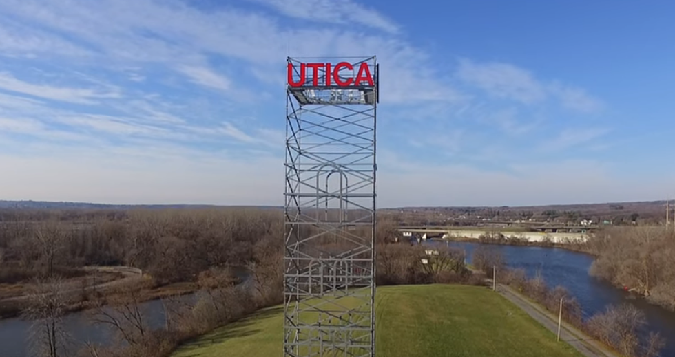 A Man Has Climbed To The Top Of The Utica Tower