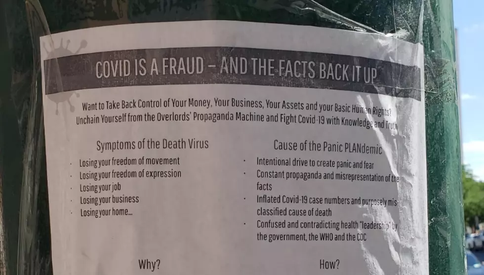 Syracuse Residents Tearing Down QAnon &#8216;Covid Is A Scam&#8217; Posters