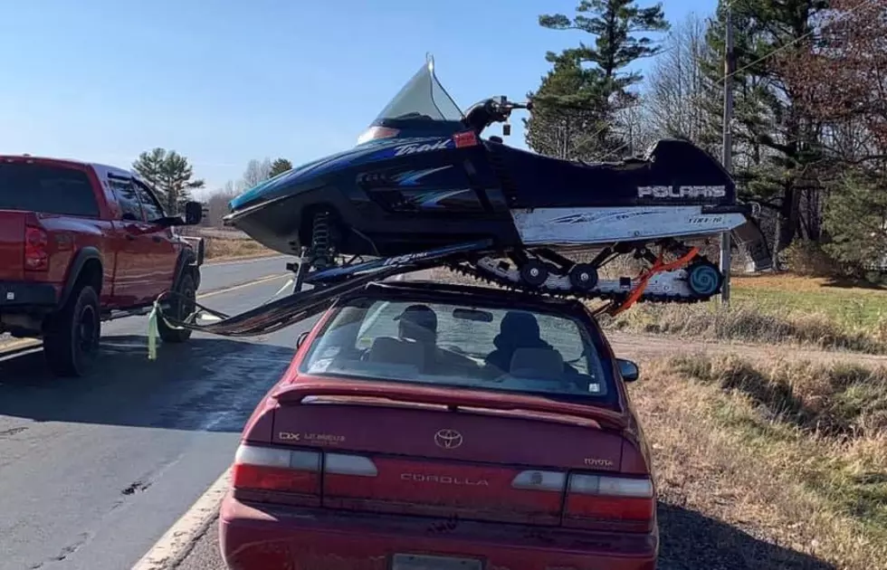 Driver Pulled Over For Hauling Snowmobile on Top of Car