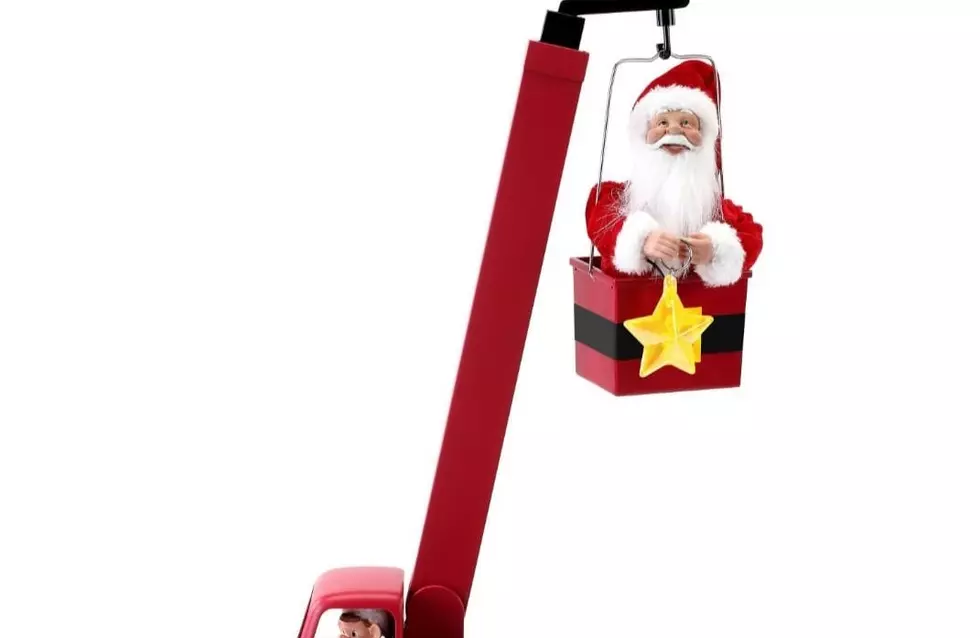 Santa Claus is Coming to Town in a Bucket Truck