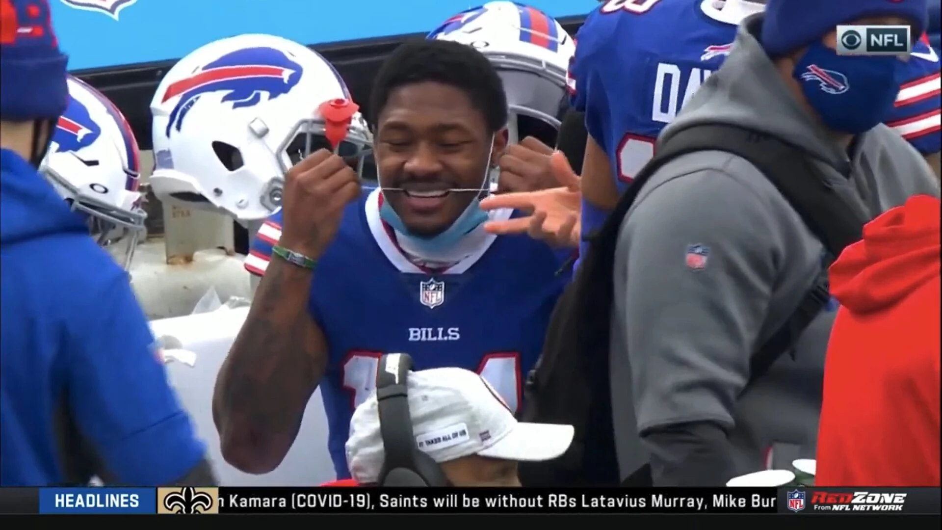 Stefon Diggs flosses teeth on the bench