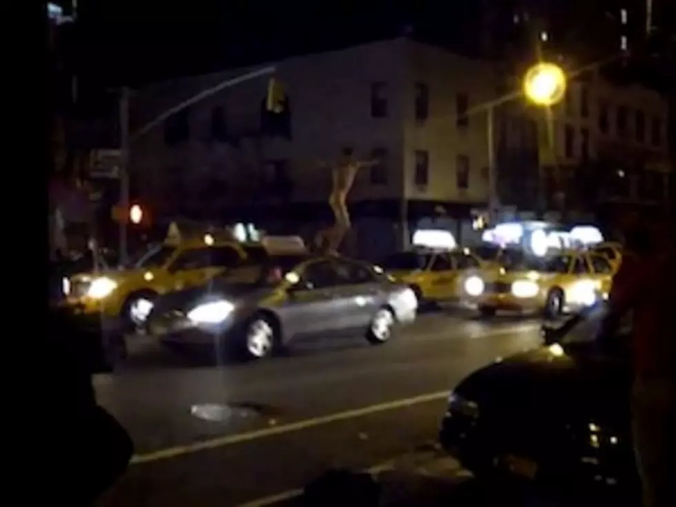 Naked Drunk Falls Off Roof of Moving Vehicle [VIDEO]
