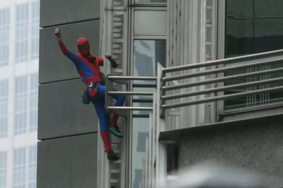 Man Wants Copy of New York Times, So He Climbs Building to Get It