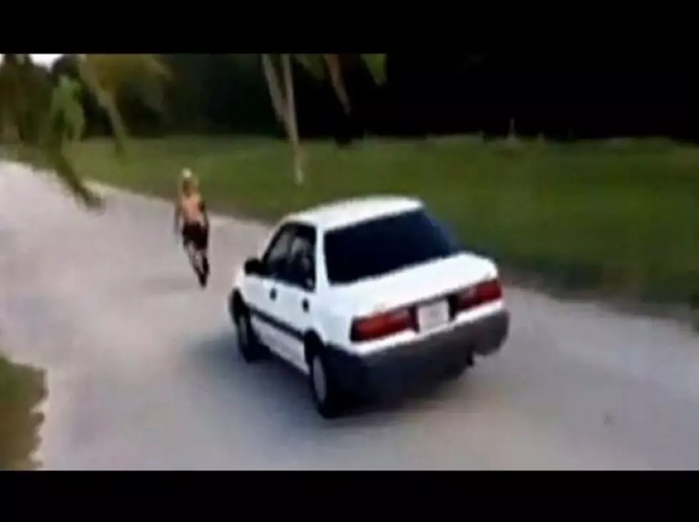Watch This Kid Try To Jump Over a Moving Car … And Fail