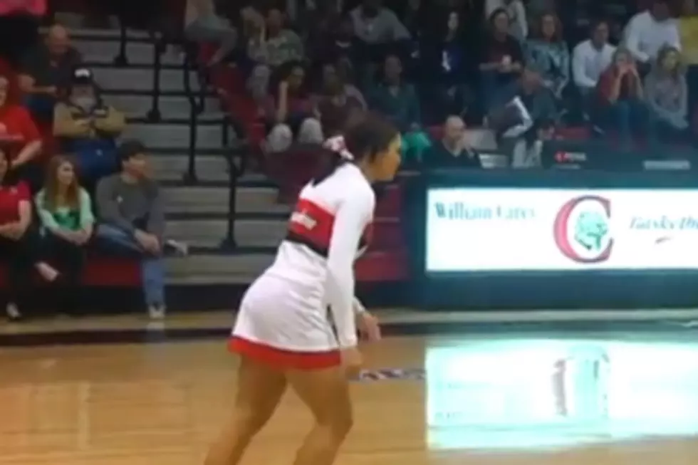 Cheerleader Makes Incredible Mid-Court Stunt Shot
