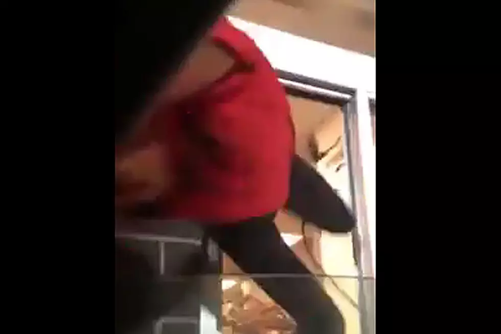 Why Is This Fast Food Worker Being Dragged Out the Drive-Thru Window?