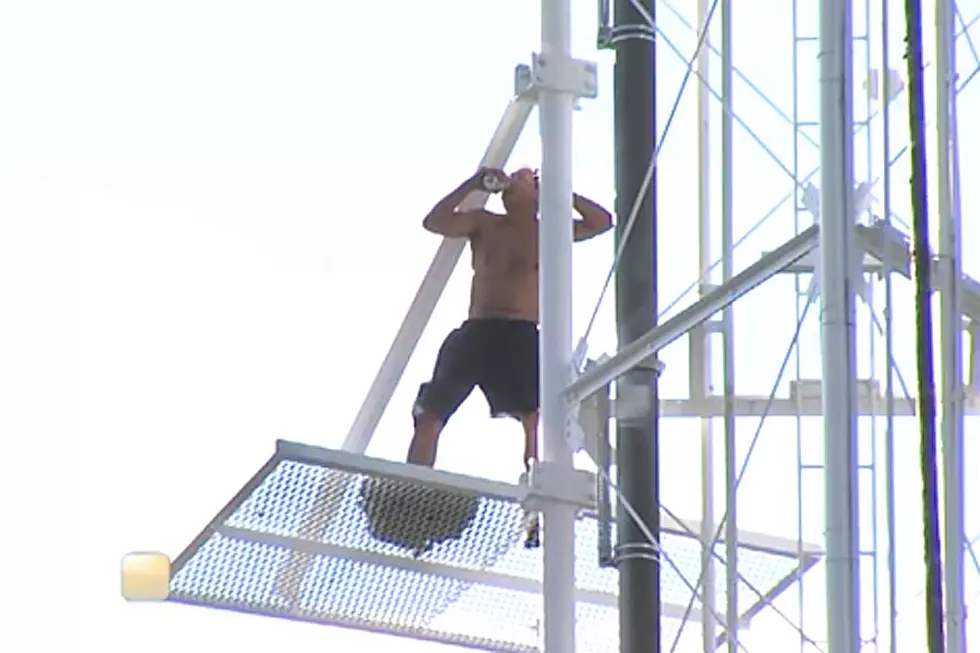 Classy Dude Climbs Broadcast Tower and Pounds Beers