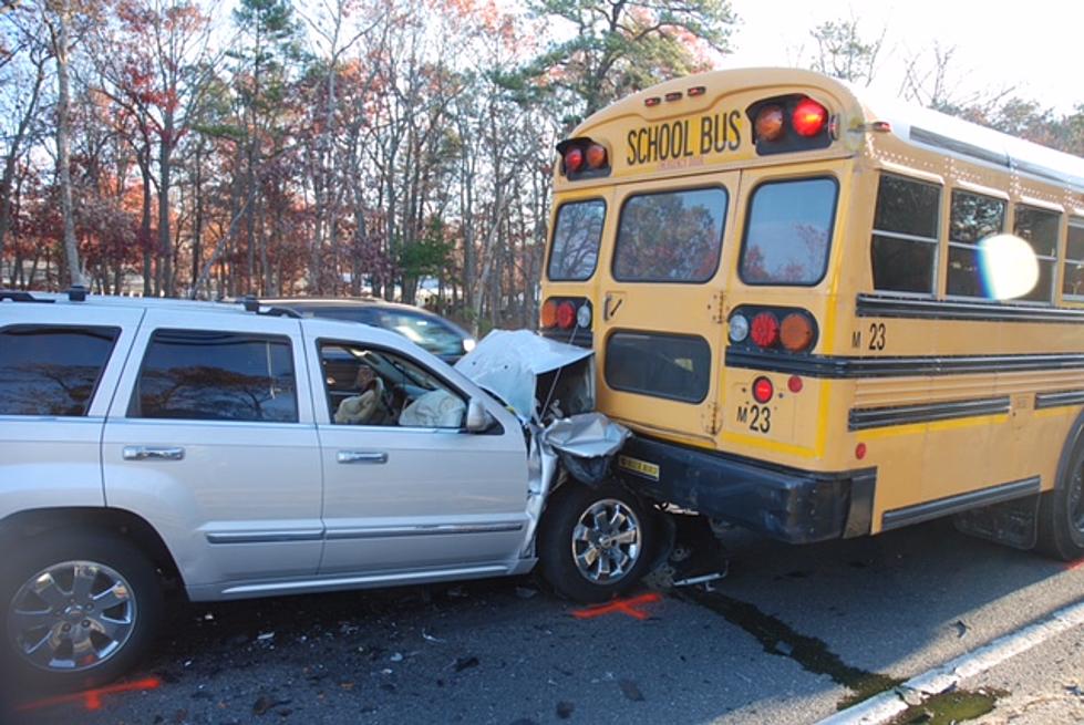 Jeep hits the rear of a school bus in Manchester and sends 3 to hospital