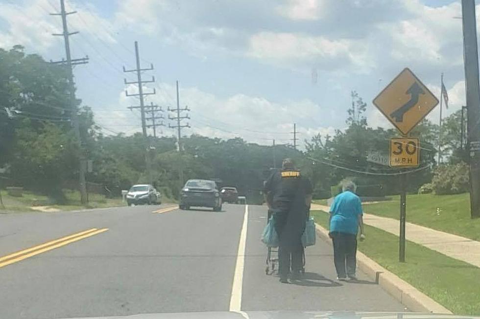 Photo Catches Local Monmouth County Officer In Heartwarming Moment With Elderly Woman