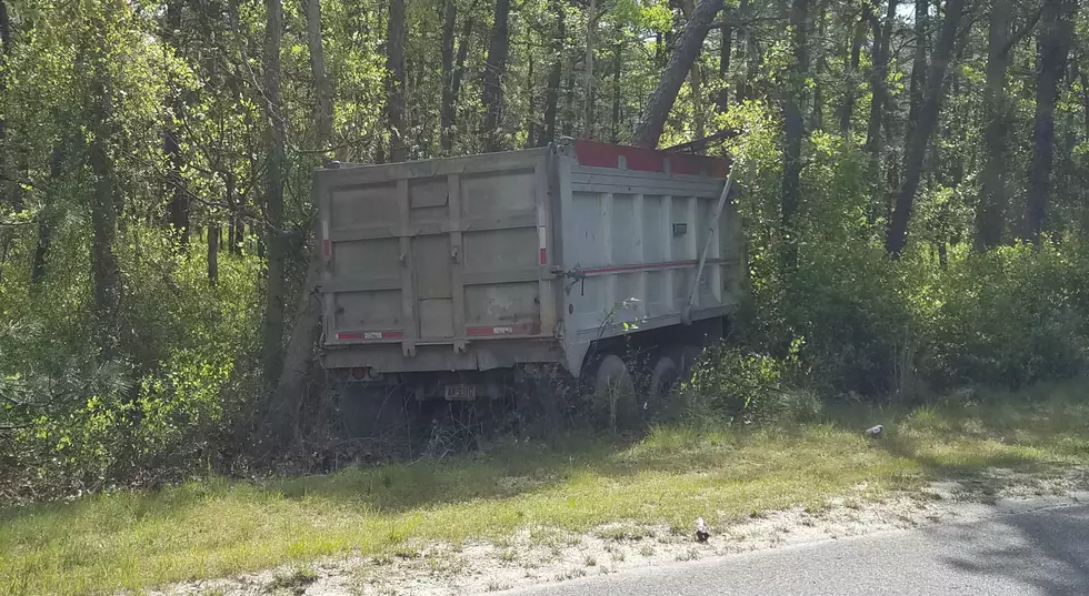 Truck careens into Manchester woods, drivers emerge unhurt, say police