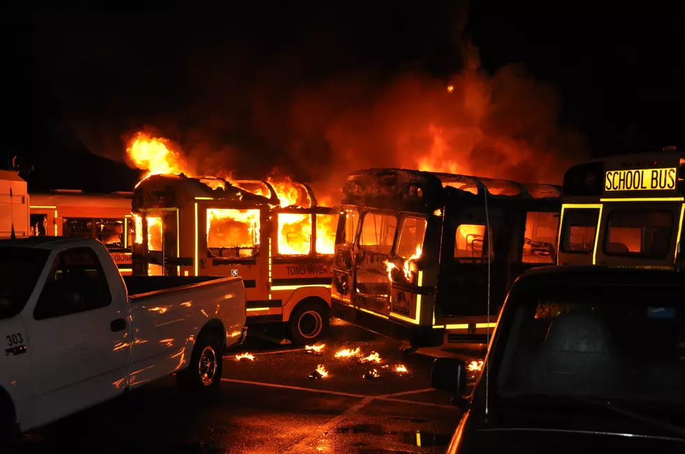 Early Friday morning fire destroys several cars and buses in TR School District lot
