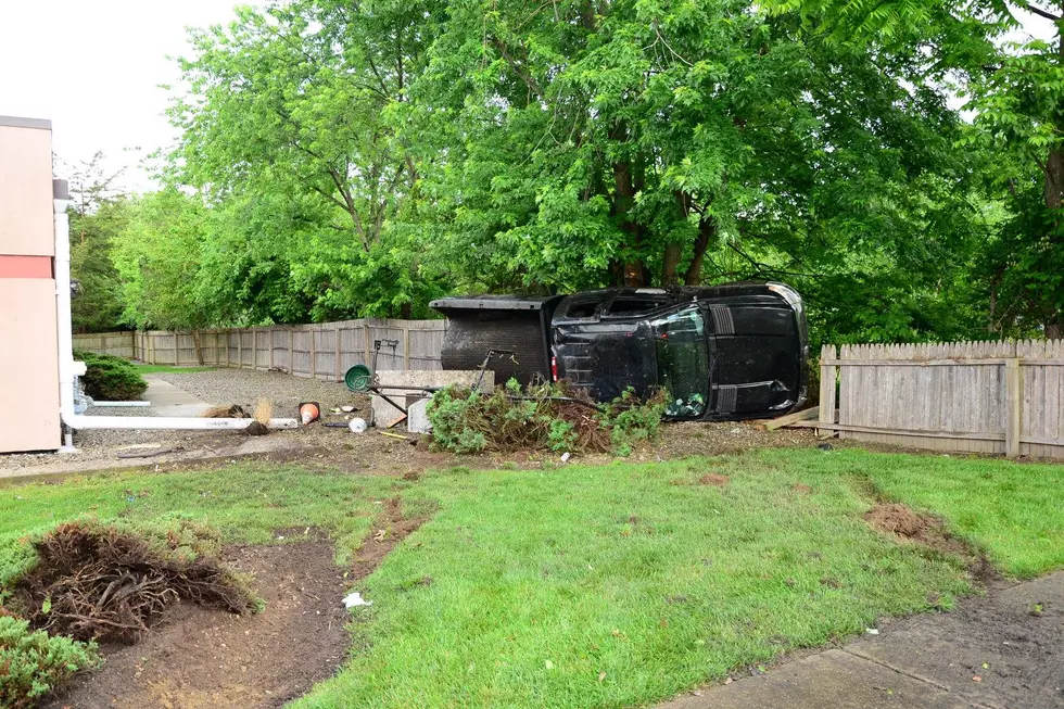 Wanted on a warrant, a driver flees, spills mulch then crashes pickup truck
