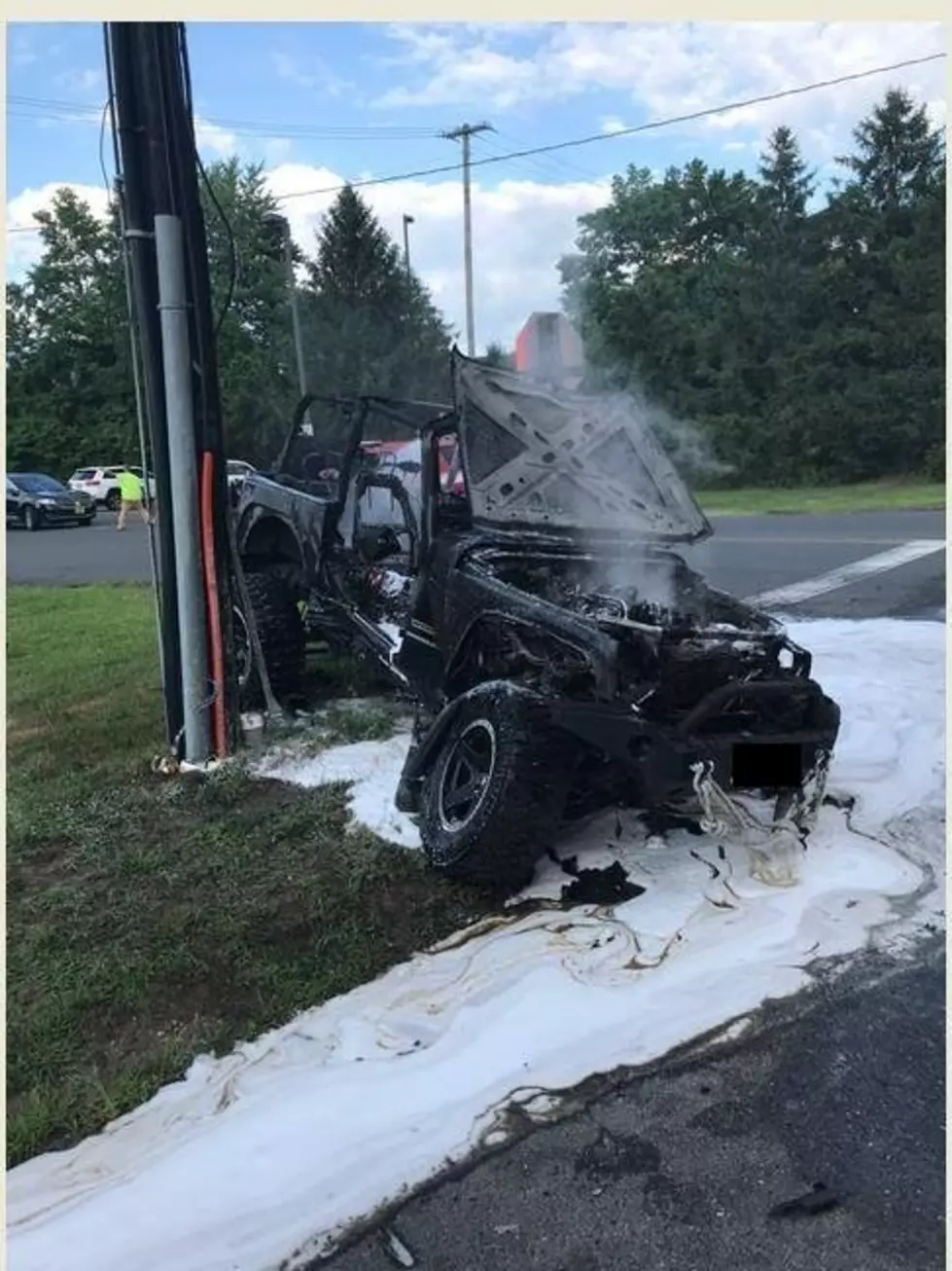 Driver And Passenger Escape Jeep That Catches Fire In Car Accident