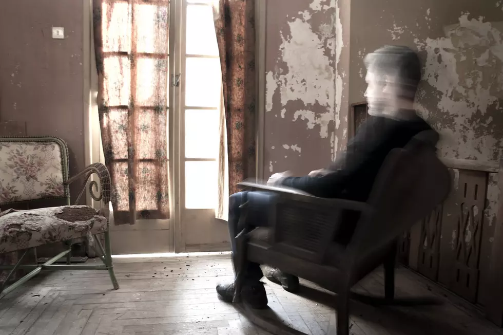 Man sitting on rocking chair