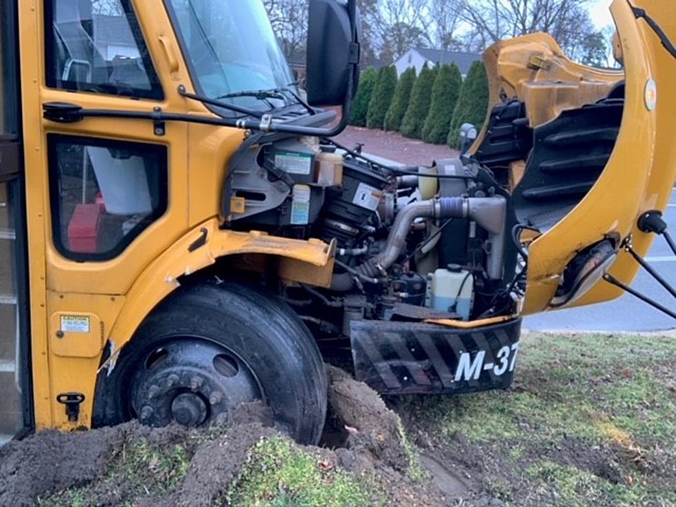 Teen driver charged after crash with school bus in Manchester