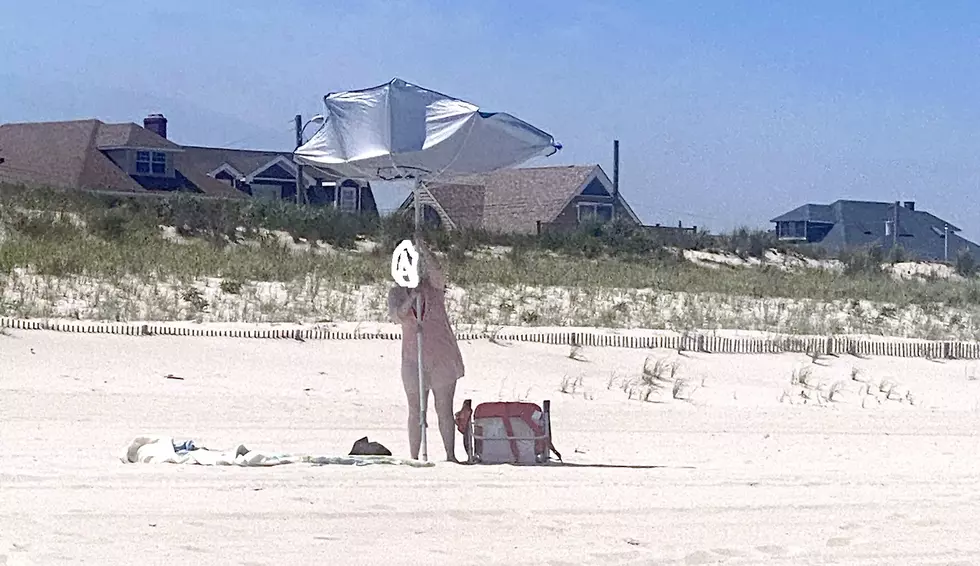 Beach Umbrellas And Rogue Waves Make For The Best Unplanned Comedy