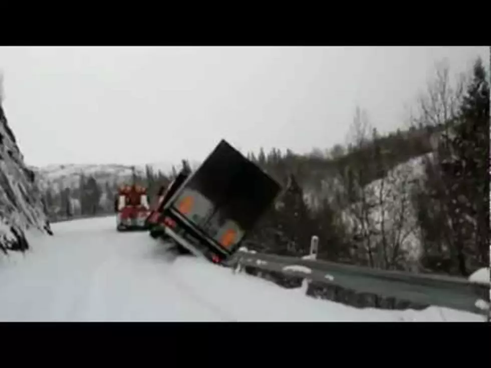 Tow Truck Falls Off Snowy Cliff! [VIDEO]