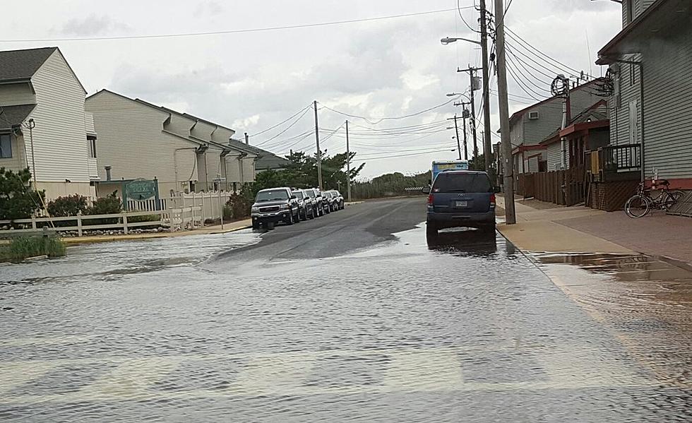 Storm pounds the coast with winds, flooding, power outages