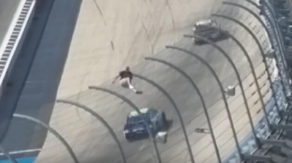 Guy Climbs Fence at NASCAR Race in Dover [VIDEO]