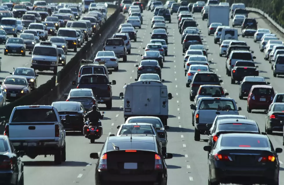 Crowded vehicle traffic and the only motorcycle in America