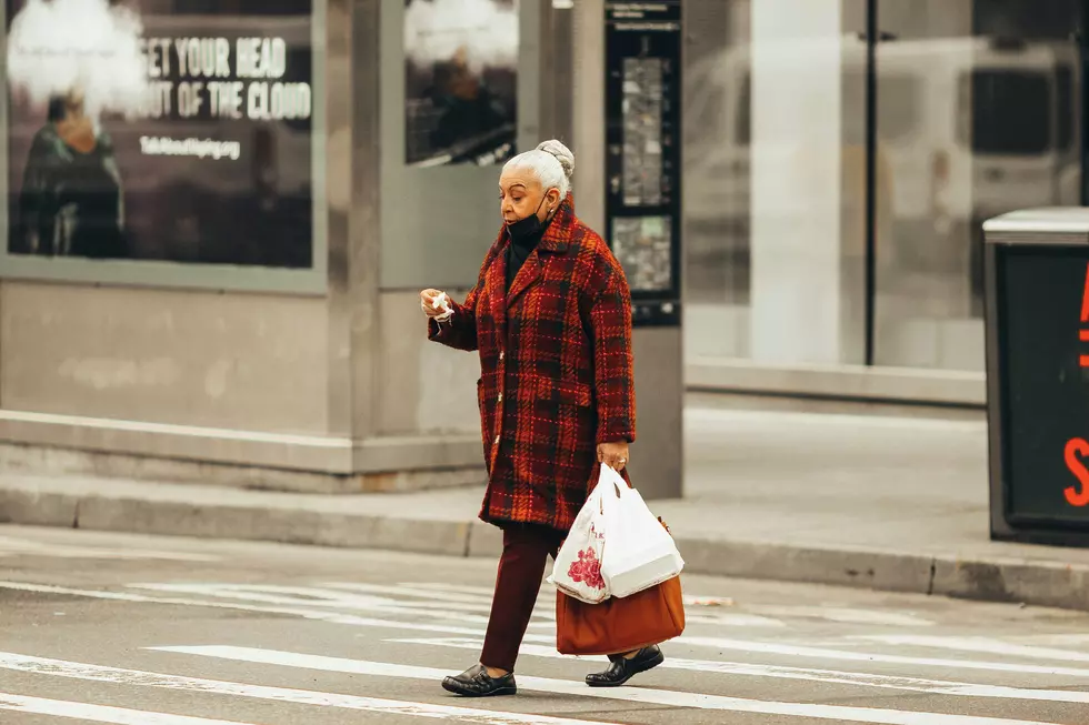 Older Woman With Shopping Bags
