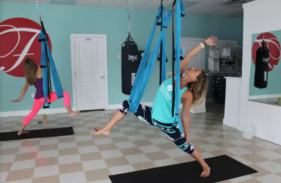 Take Your Yoga Practice To New Heights With Aerial Yoga (WATCH)