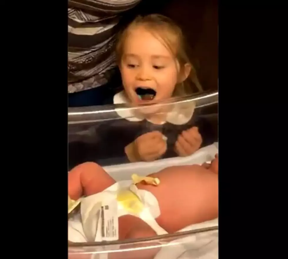 Watch Little Girl Sing Eagles Fight Song to Newborn Baby Sister