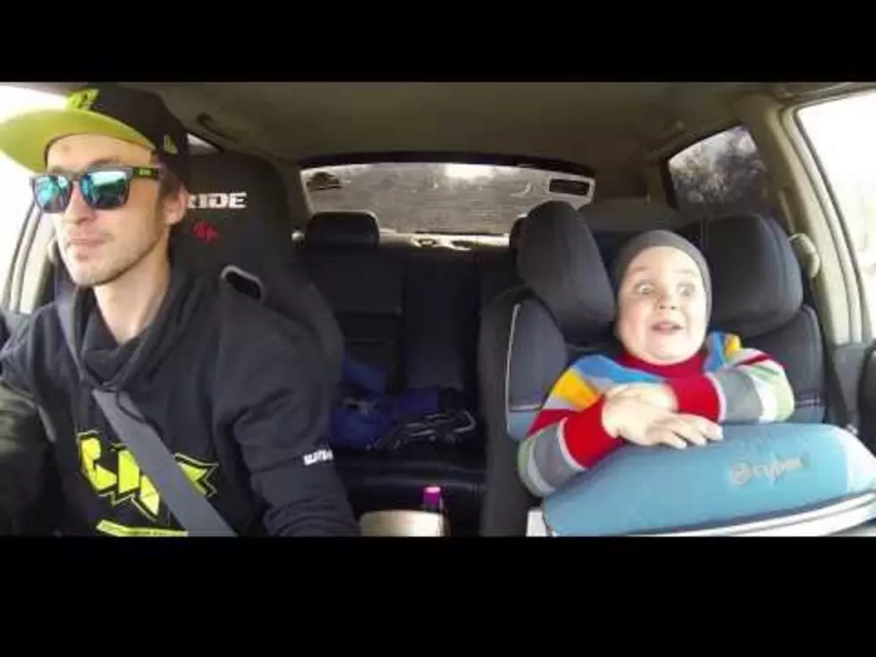 Three-Year Old Makes Hilarious Faces While Riding in a Race Car [VIDEO]