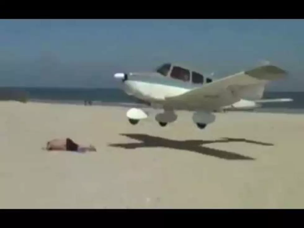 Plane Lands Short of the Runway And Almost Hits a Guy Sunbathing [VIDEO]